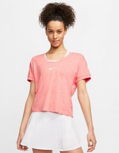 Model in Nike Womens Elevated Essentials Short Sleeve Top sunblush